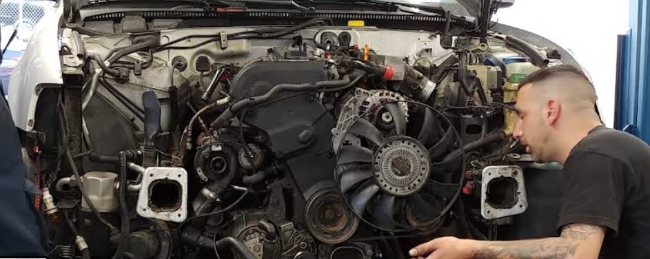 Frank's mechanic doing engine work