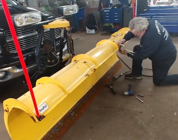 Frank's crew servicing a snow plow