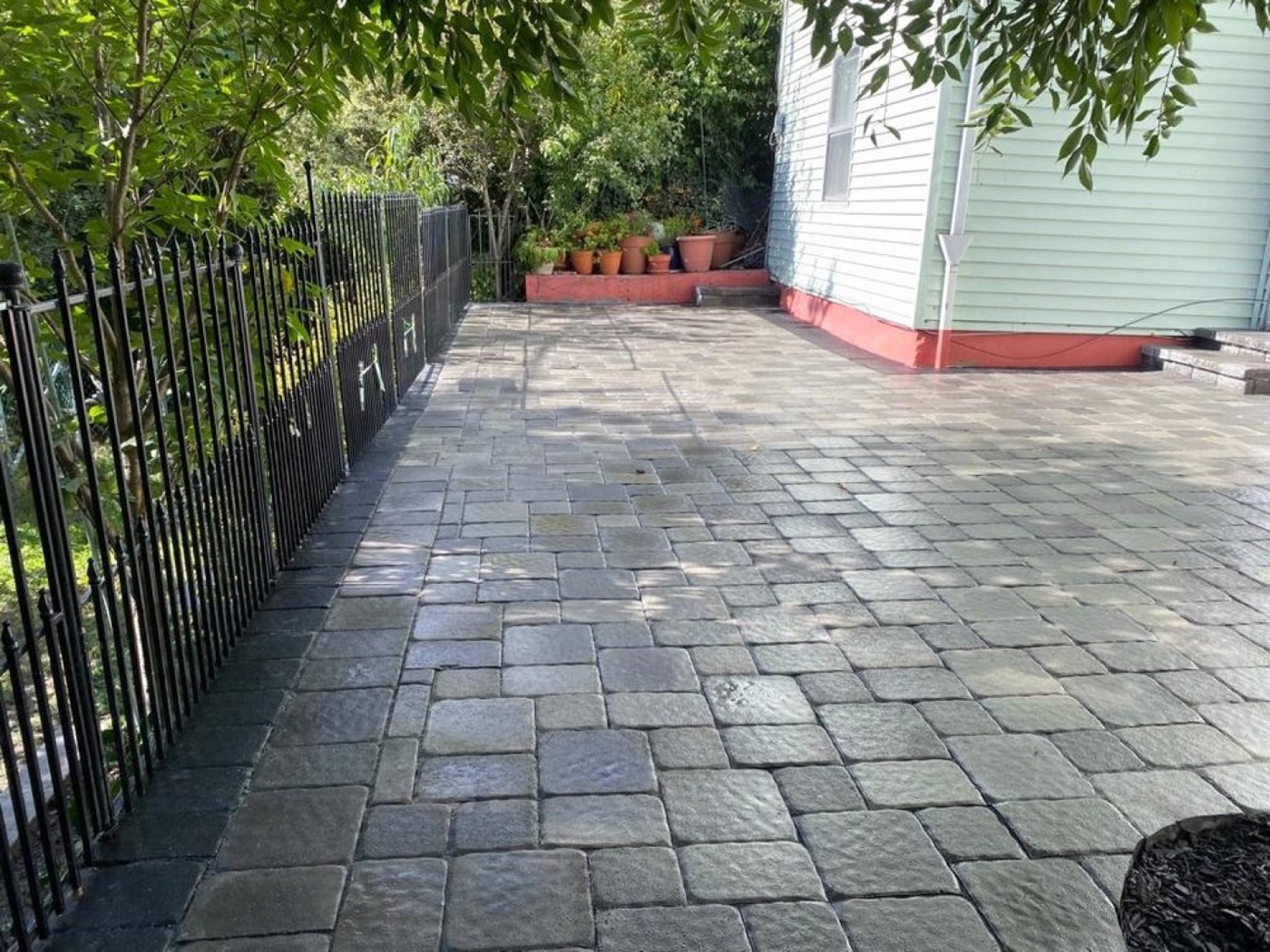 Paver patio installation by RM Affordable Landscaping